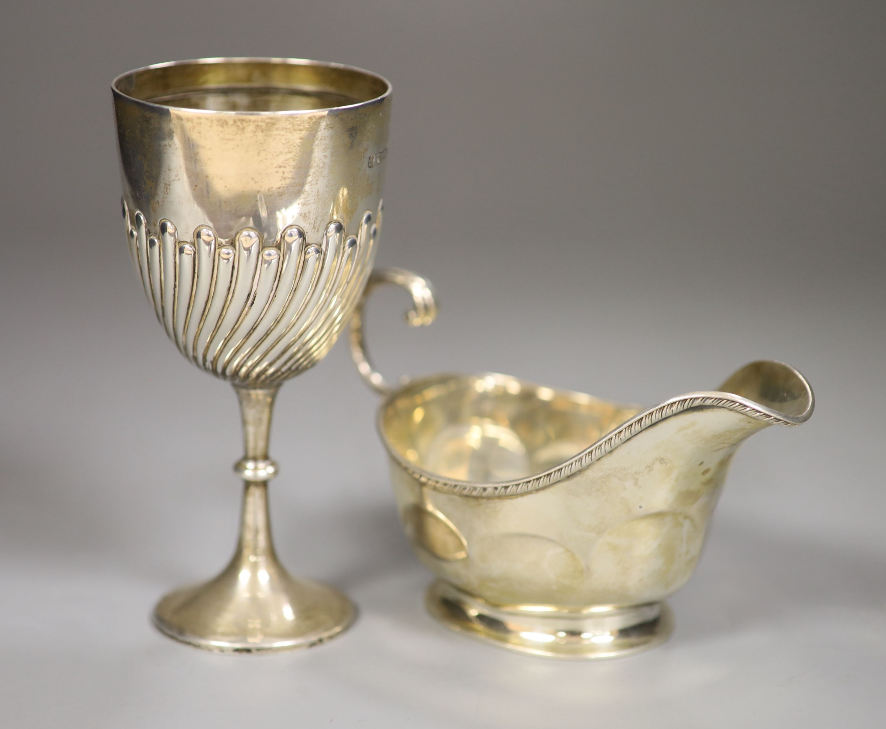 A George V silver sauceboat, Birmingham, 1929, and a small silver goblet, Sheffield, 1897, 7.5oz.